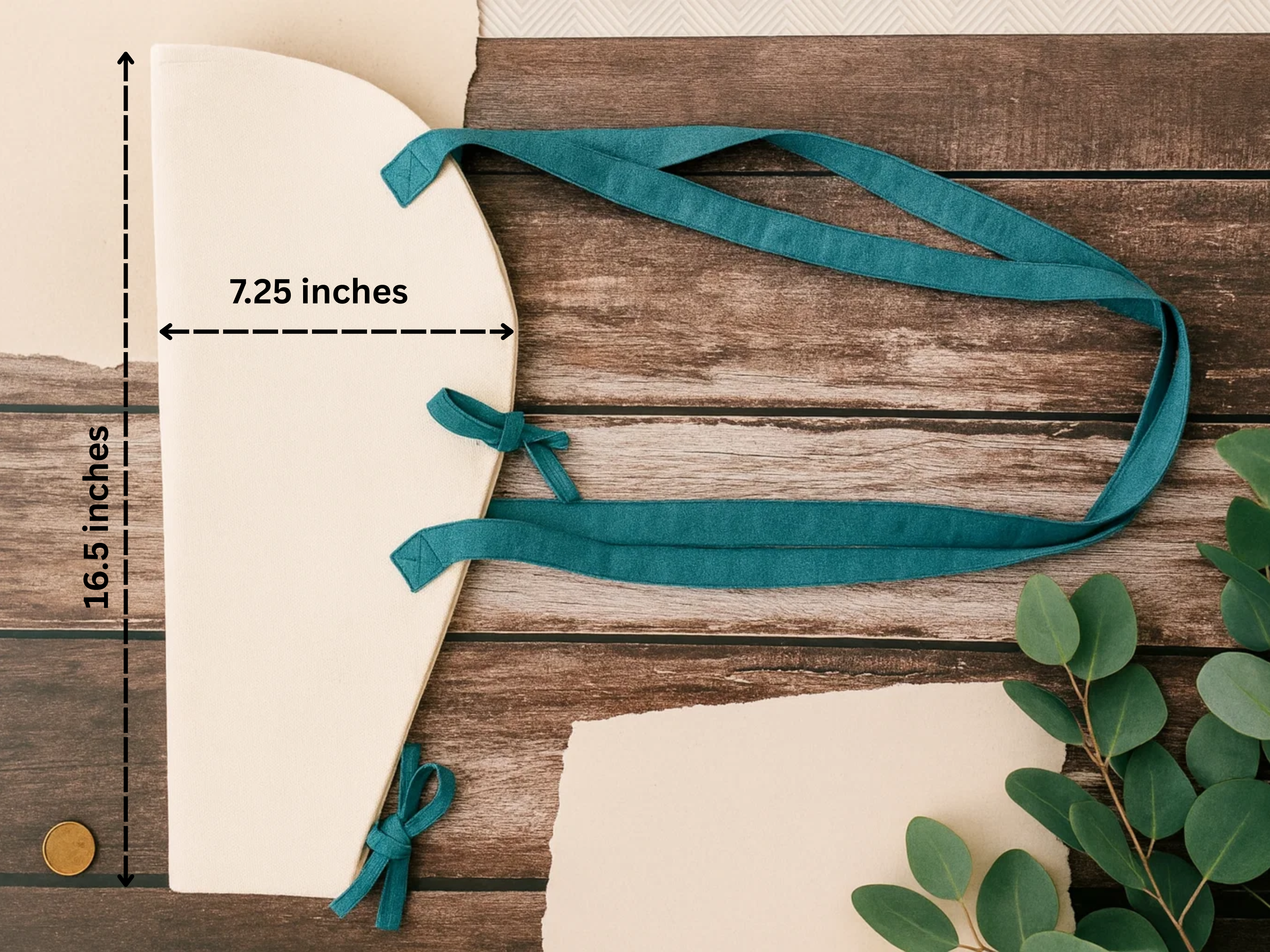 Teal ribbon on a wooden surface with measurements indicated