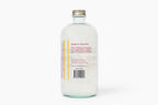 Clear bottle with a label on a white background