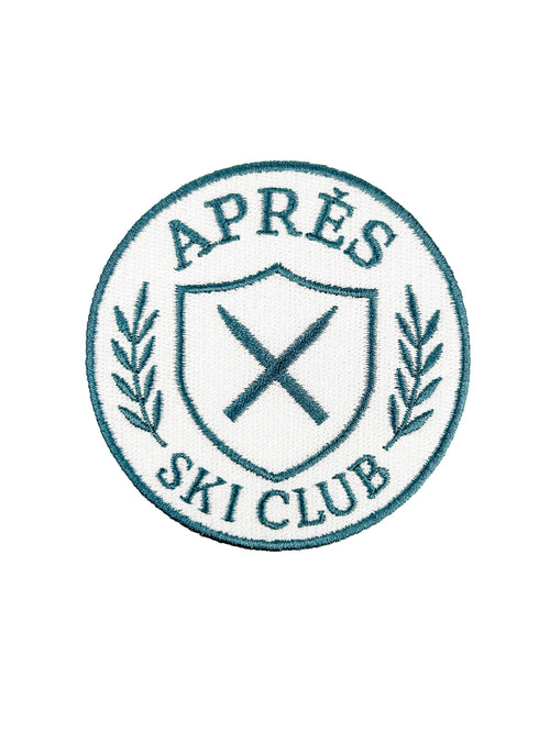 Logo of Après Ski Club with crossed skis and laurel leaves on a white background
