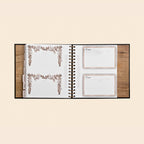 Open planner with floral design on a beige background