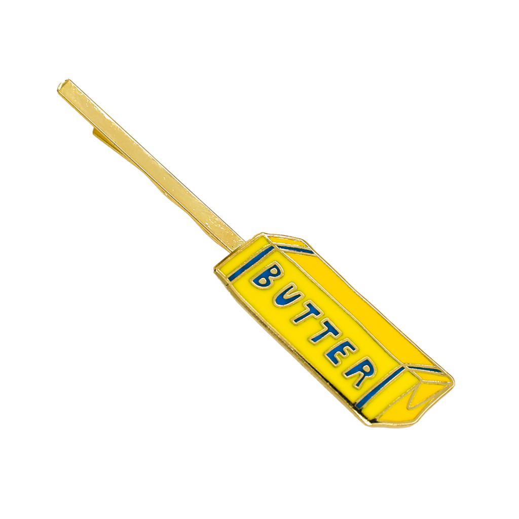 Yellow butter paddle with 'BUTTER' text on a white background
