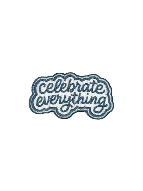 Embroidered patch with 'Celebrate Everything' text on a white background