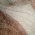 A close-up of sheer mesh fabric with a fine grid texture, layered in soft blush pink and warm taupe-beige tones.