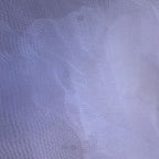 A close-up of a white sheer mesh fabric with a fine grid texture.
