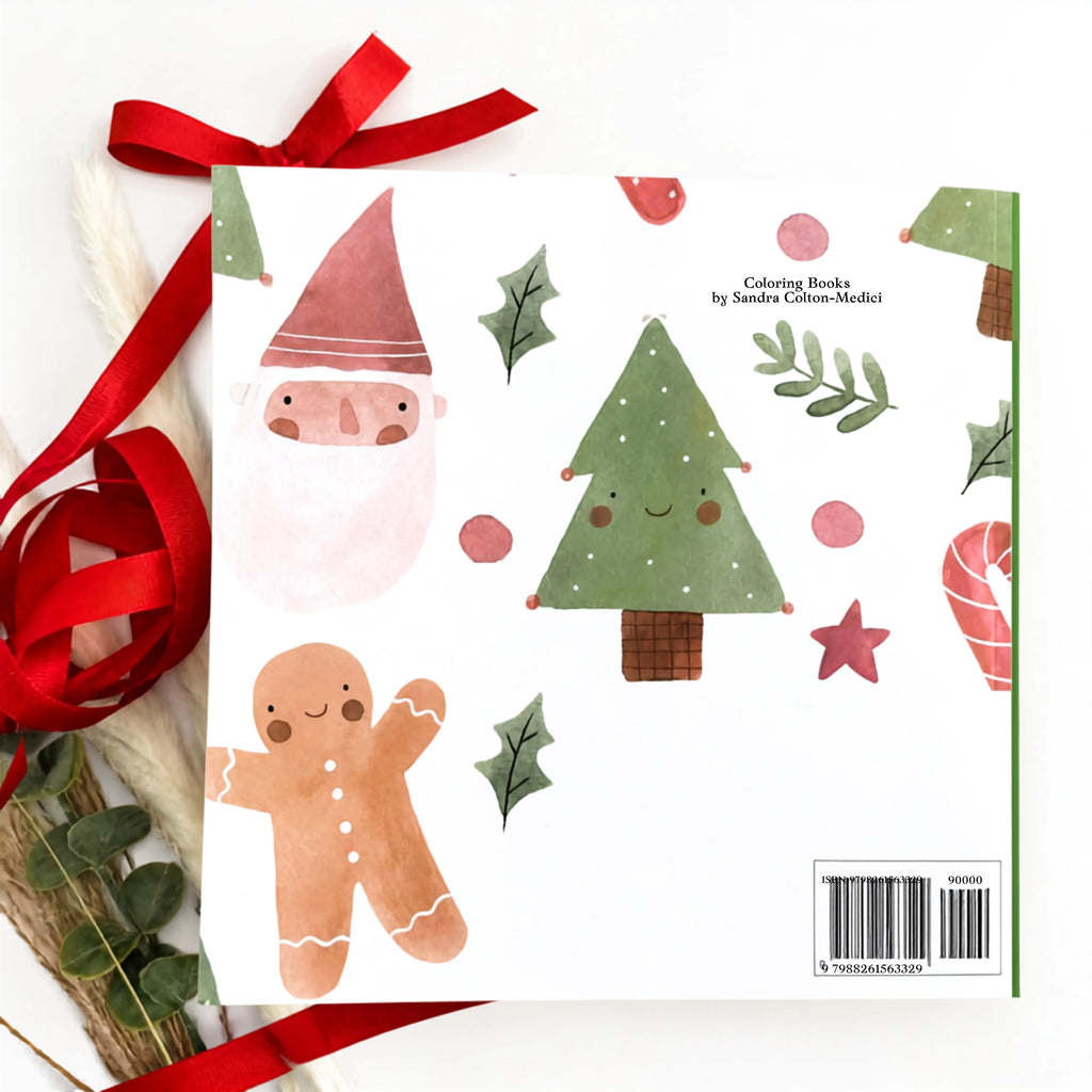 A children's coloring book with a white cover decorated with cute Christmas illustrations, including a Santa face, a green Christmas tree, a gingerbread man, holly leaves, and candy canes. The book is styled with a red ribbon and dried botanicals on a white background.