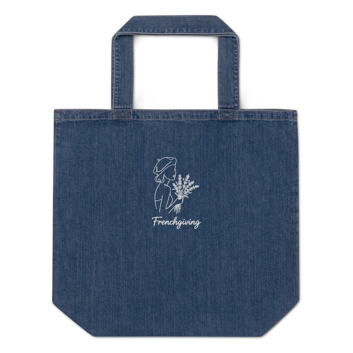 A blue denim tote bag with a white line-art graphic of a woman holding flowers and the text 'Frenchgiving' printed on the front, set against a plain white background.