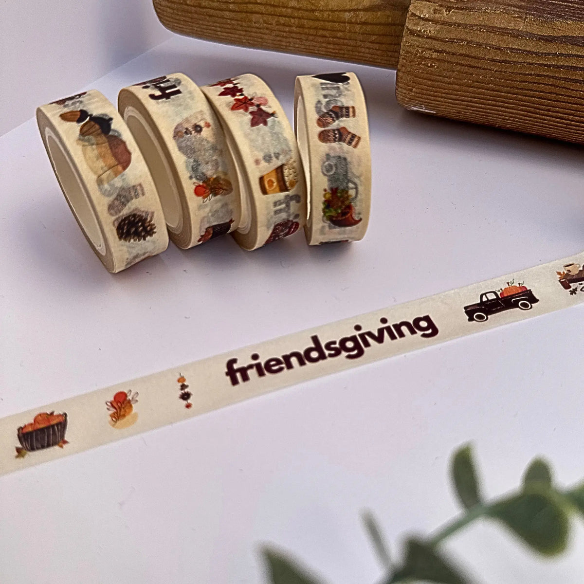 Custom Friendsgiving Washi Tape displayed on a white background with a brown rolling pin next to four rolls of washi tape 