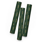 Three cylindrical sheets of wrapping paper with colorful designs on a white background