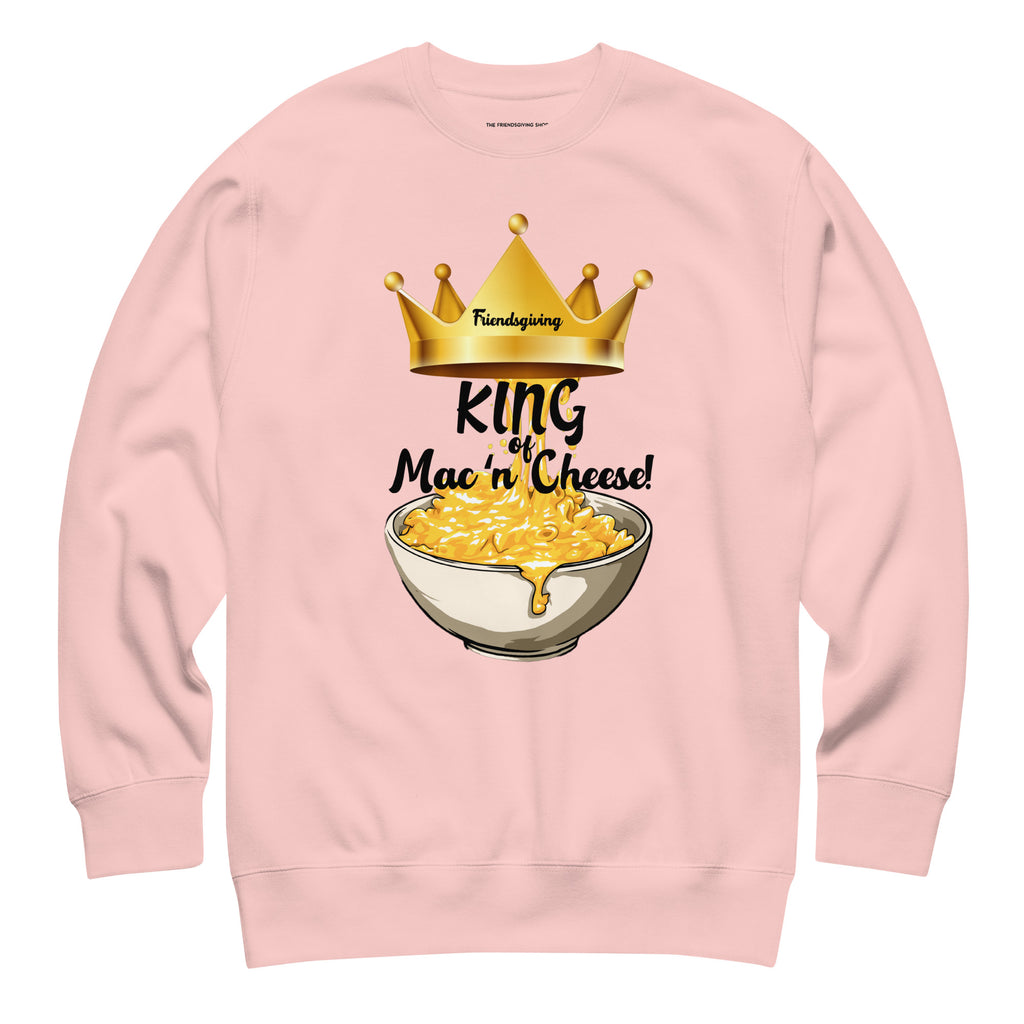 Pink sweatshirt with a graphic of macaroni and cheese and a crown on a white background