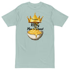 Light blue t-shirt with a graphic of a bowl of mac and cheese and a crown, on a white background.