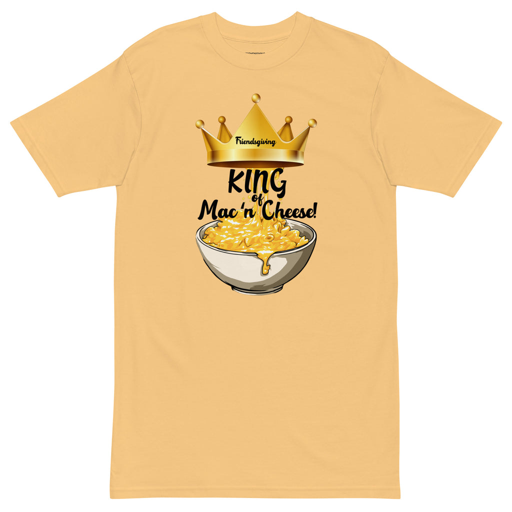 Beige t-shirt with a graphic of macaroni and cheese and a crown, labeled 'King of Mac n' Cheese'.