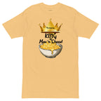 Beige t-shirt with a graphic of macaroni and cheese and a crown, labeled 'King of Mac n' Cheese'.