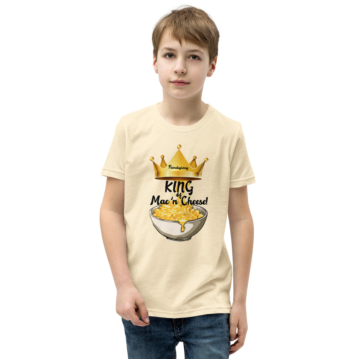 Child wearing a cream t-shirt with 'King of Mac n Cheese' graphic design on a white background