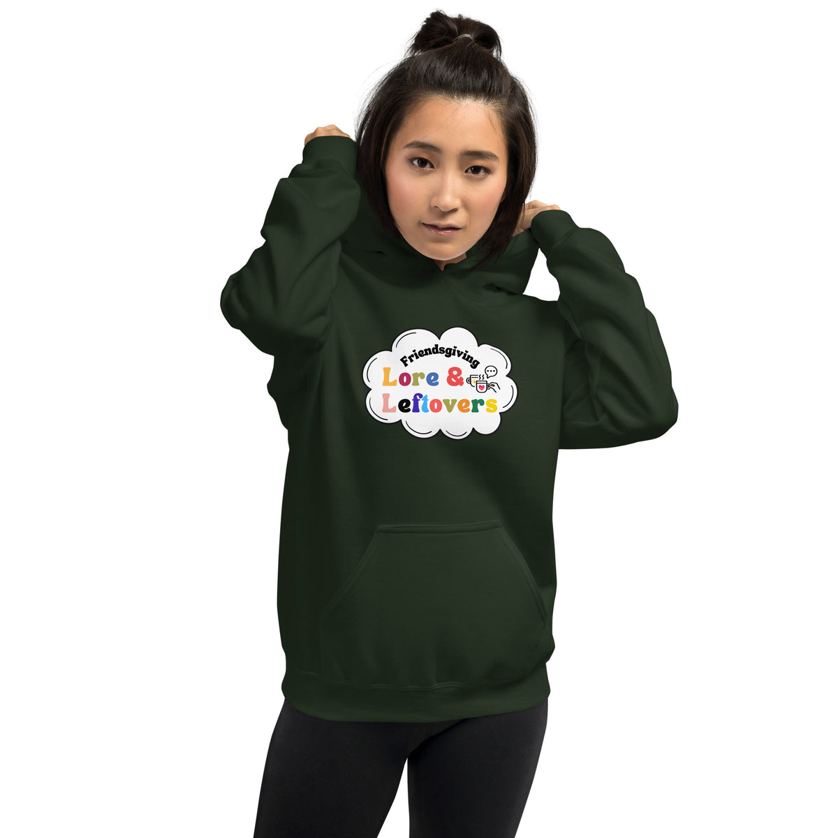 Person wearing a dark green hoodie with text design on a white background