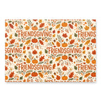 A rectangular decorative print or card featuring a repeating autumn pattern with the word 'FRIENDSGIVING' in orange script, surrounded by fall leaves, pumpkins, acorns, and berries on a cream background.
