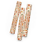 Three rolls of wrapping paper with a Thanksgiving autumn pattern, featuring the words 'FRIENDS GIVING' in orange lettering, displayed on a clean white background.