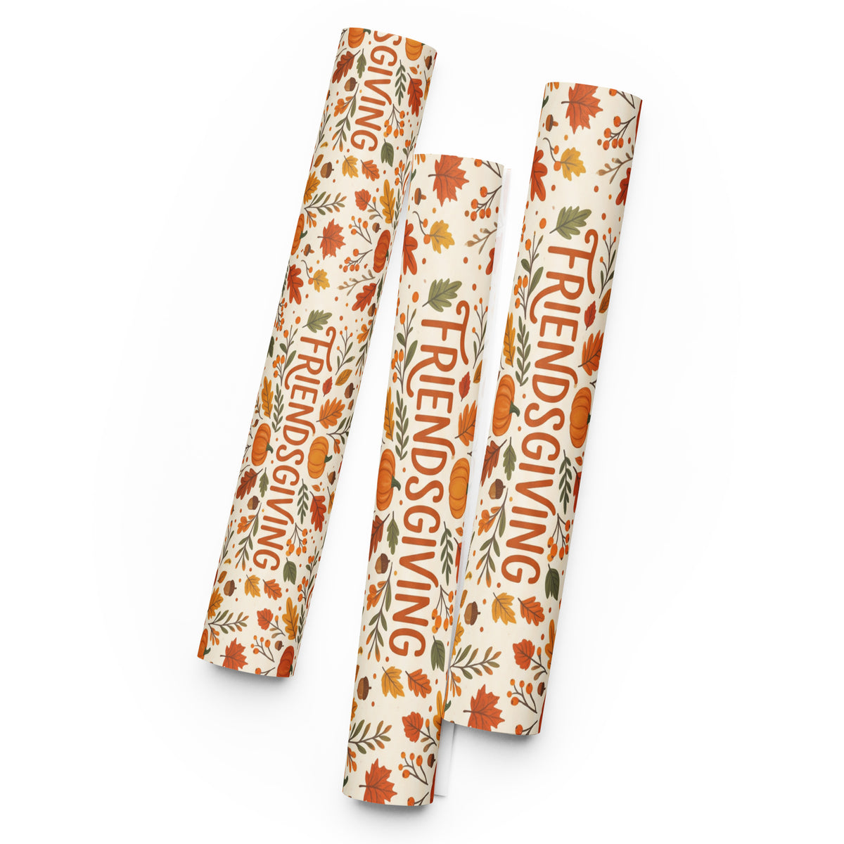 Three rolls of wrapping paper with a Thanksgiving autumn pattern, featuring the words 'FRIENDS GIVING' in orange lettering, displayed on a clean white background.