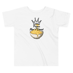 A white short-sleeve kids' t-shirt with a graphic print of a crown, the word 'Friendsgiving', and the text 'Prince of Mac 'n' Cheese!' above an illustration of a bowl of macaroni and cheese.