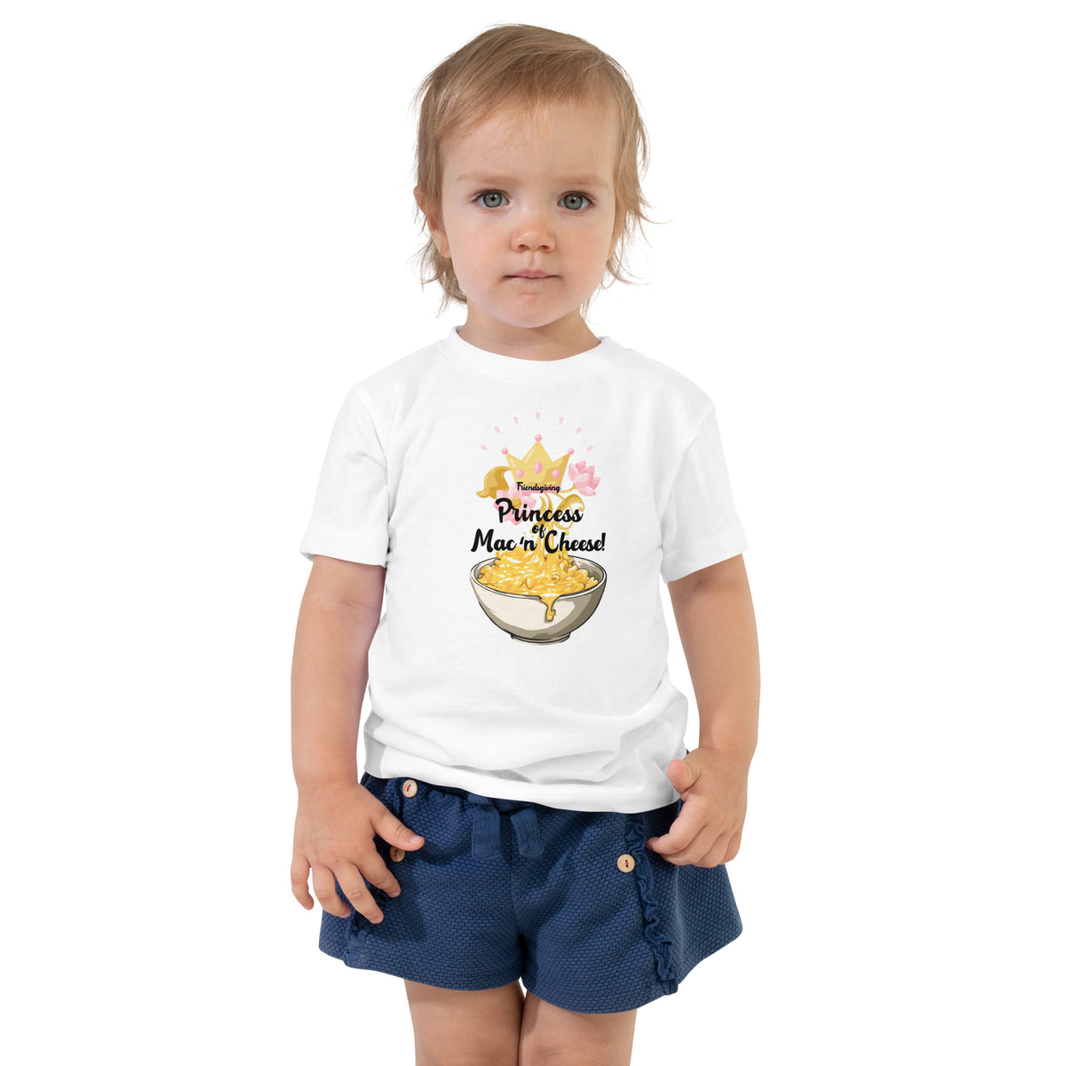 Child wearing a white t-shirt with a graphic design on a white background