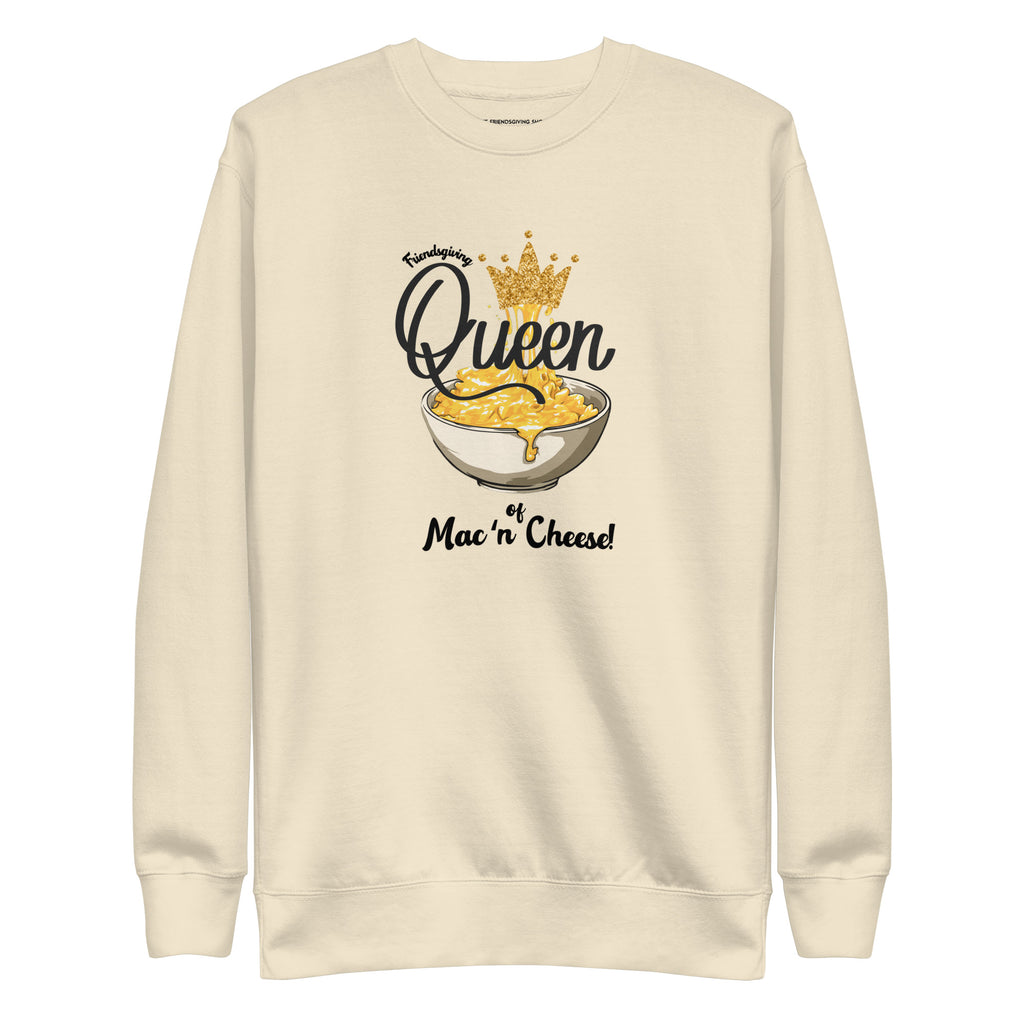 Beige sweatshirt with mac and cheese graphic and text on a white background