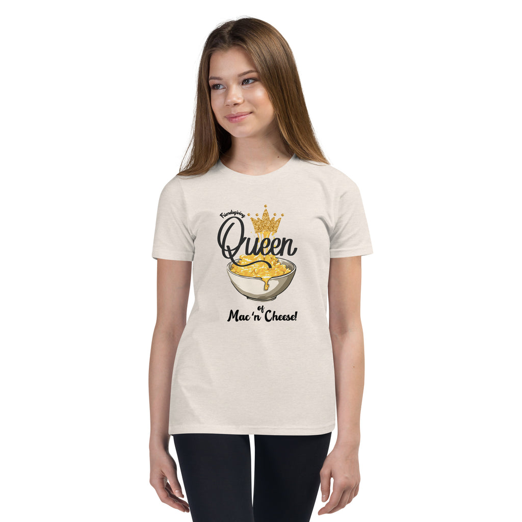 Young girl wearing a heather dust  t-shirt with a colorful mac n cheese design on a white background