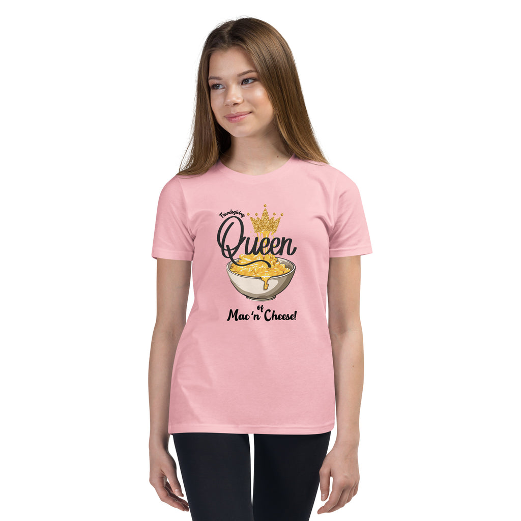 Girl wearing a pink t-shirt with 'Queen of Mac n Cheese' design on a white background