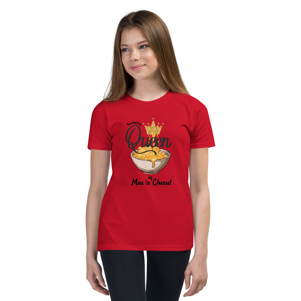A young woman modeling a bright red short-sleeve t-shirt with a graphic print of a cheese crown and the text 'Queen of Mac 'n' Cheese'.