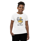 A young boy wearing a white graphic t-shirt with a 'Queen of Mac 'n Cheese' cereal design, paired with black pants, photographed against a solid white background.