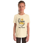 Child wearing a cream t-shirt with 'Queen of Mac n Cheese' graphic design on a white background