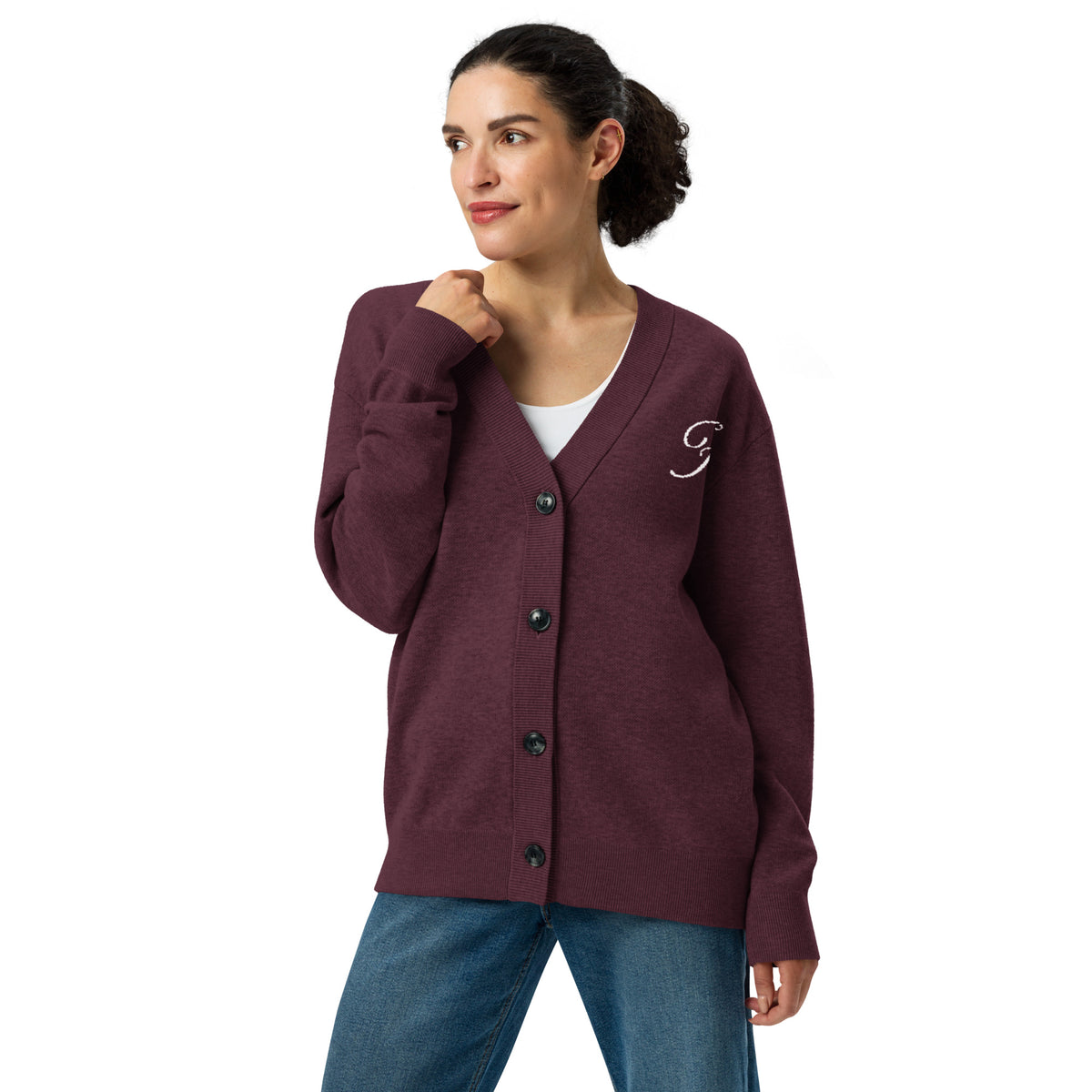 Woman wearing a burgundy cardigan on a white background