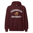 A maroon pullover hoodie with a front kangaroo pocket and a graphic on the chest that reads 'FRIENDSGIVING UNIVERSITY' in white arched text, with a cartoon squirrel in the center.