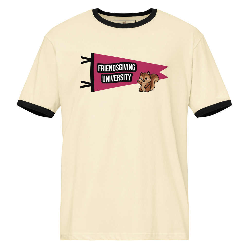 An off-white ringer t-shirt with black trim on the collar and sleeve cuffs, featuring a graphic of a pink pennant flag that reads 'FRIENDSGIVING UNIVERSITY' next to a mascot brown squirrel.