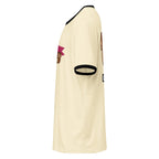 A cream-colored ringer t-shirt shown from a side profile view, featuring black trim on the collar and sleeve cuffs, with cartoon graphic prints on the chest and sleeve.