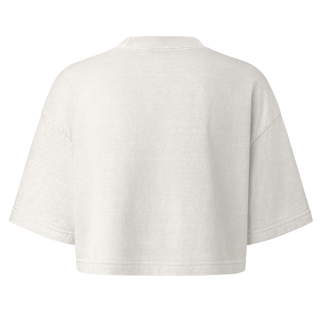 A cropped short-sleeve t-shirt shown from the back, in a light off-white or cream color, displayed on a solid white background.