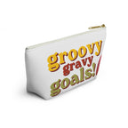 A white zippered pouch with a retro-style graphic reading 'groovy gravy goals!' in yellow, red, and olive green lettering, shown on a clean white background.