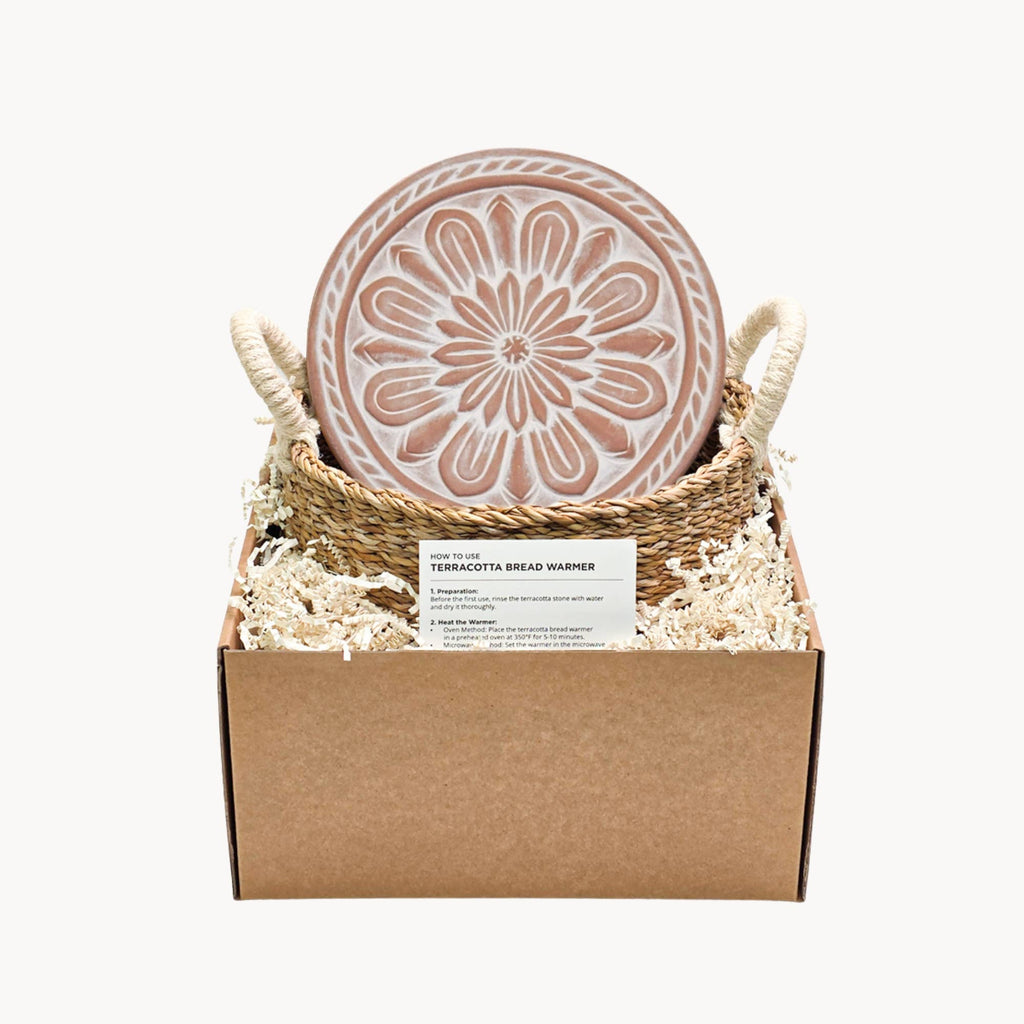 Terracotta bread warmer in a box with decorative elements