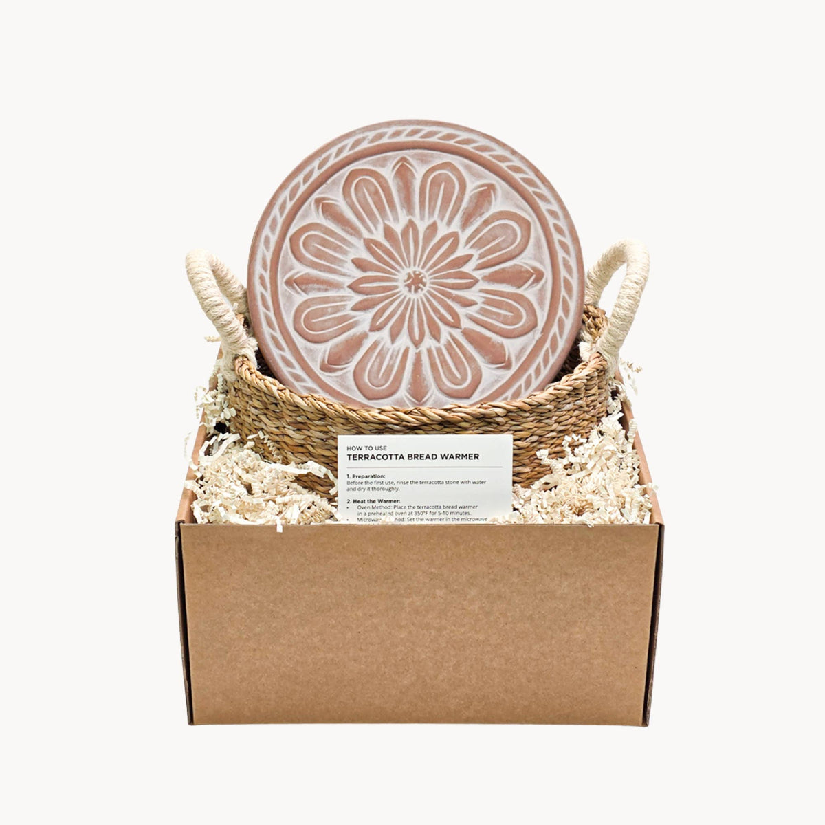 Terracotta bread warmer in a box with decorative elements