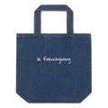 A blue denim tote bag with 'le frenchiving' embroidered in white script on the front, set against a plain white background.