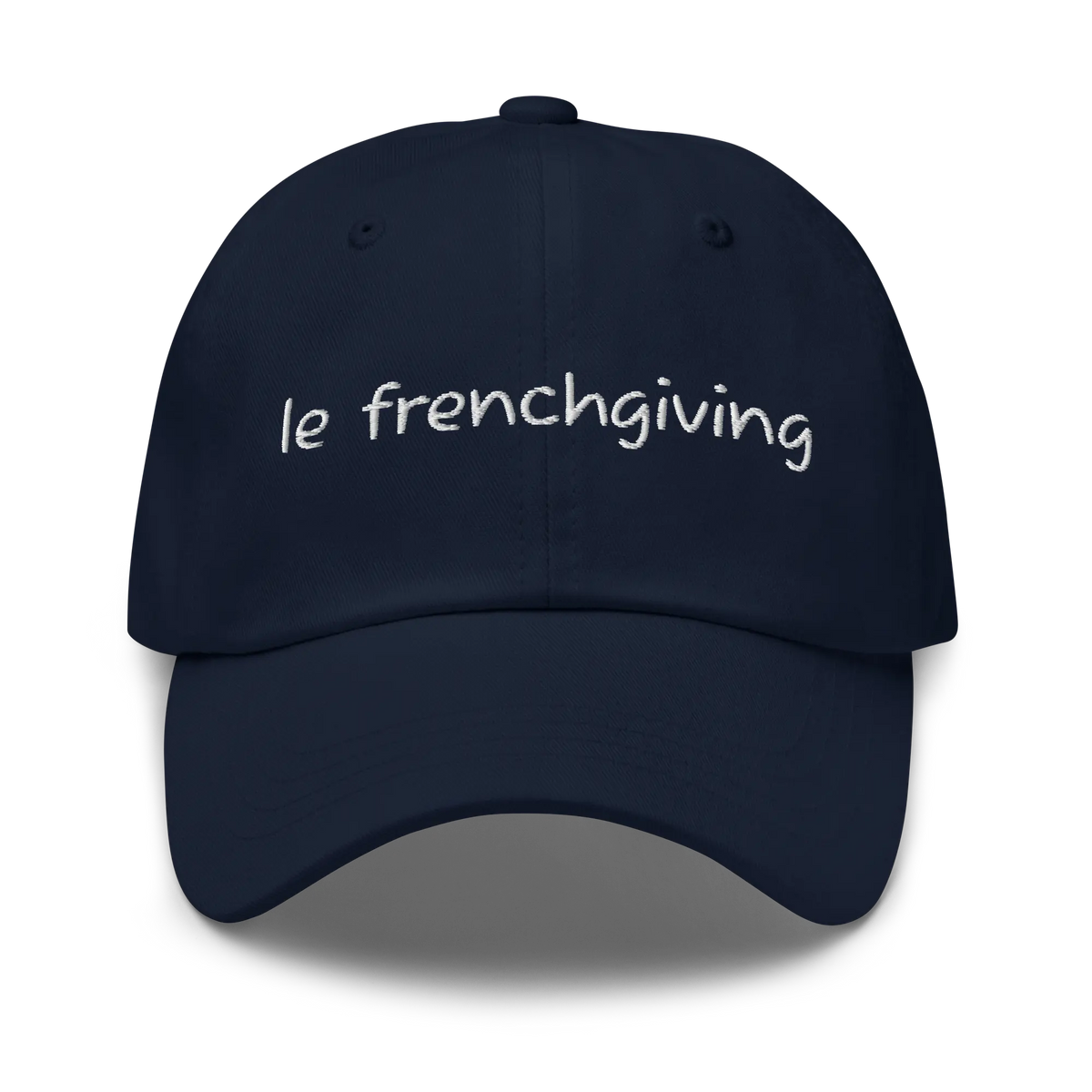A navy blue baseball cap with 'le frenchgiving' embroidered in white script across the front, shown against a plain white background.
