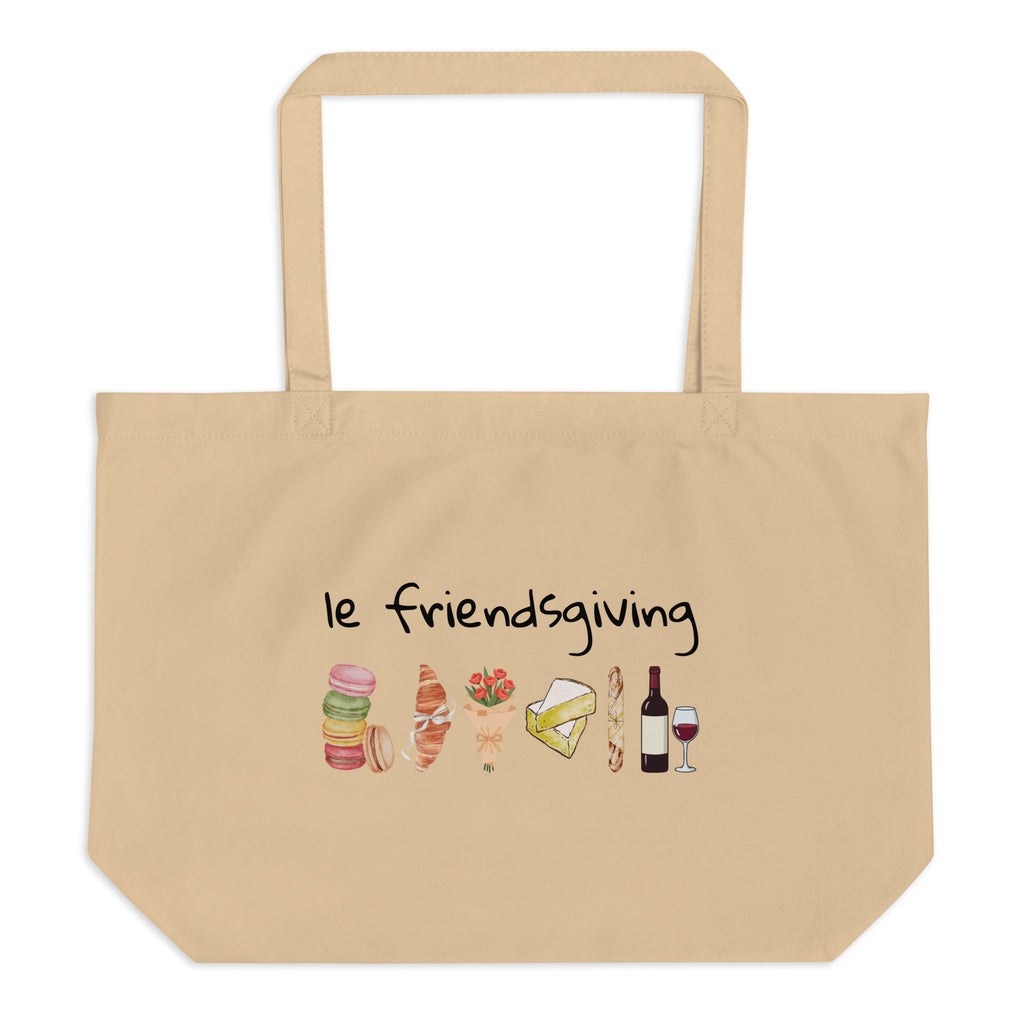Beige tote bag with 'le friendsgiving' text and food illustrations on a white background