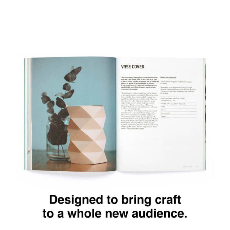 Open book with a geometric vase cover and text on a white background