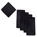 Five black square napkins, with four folded and stacked and one unfolded showing the fabric texture, on a plain white background.