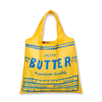 Yellow tote bag designed to look like a butter container with blue text on a white background