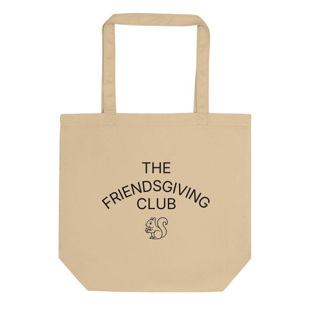 A beige canvas tote bag with black printed text reading 'THE FRIENDSGIVING CLUB' and a small squirrel illustration on the front, shown against a plain white background.