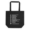 A black canvas tote bag with two handles, featuring a white printed list of 'Noot' days around the calendar and the text 'THE FRIENDSGIVING SHOP' with a small heart at the bottom.