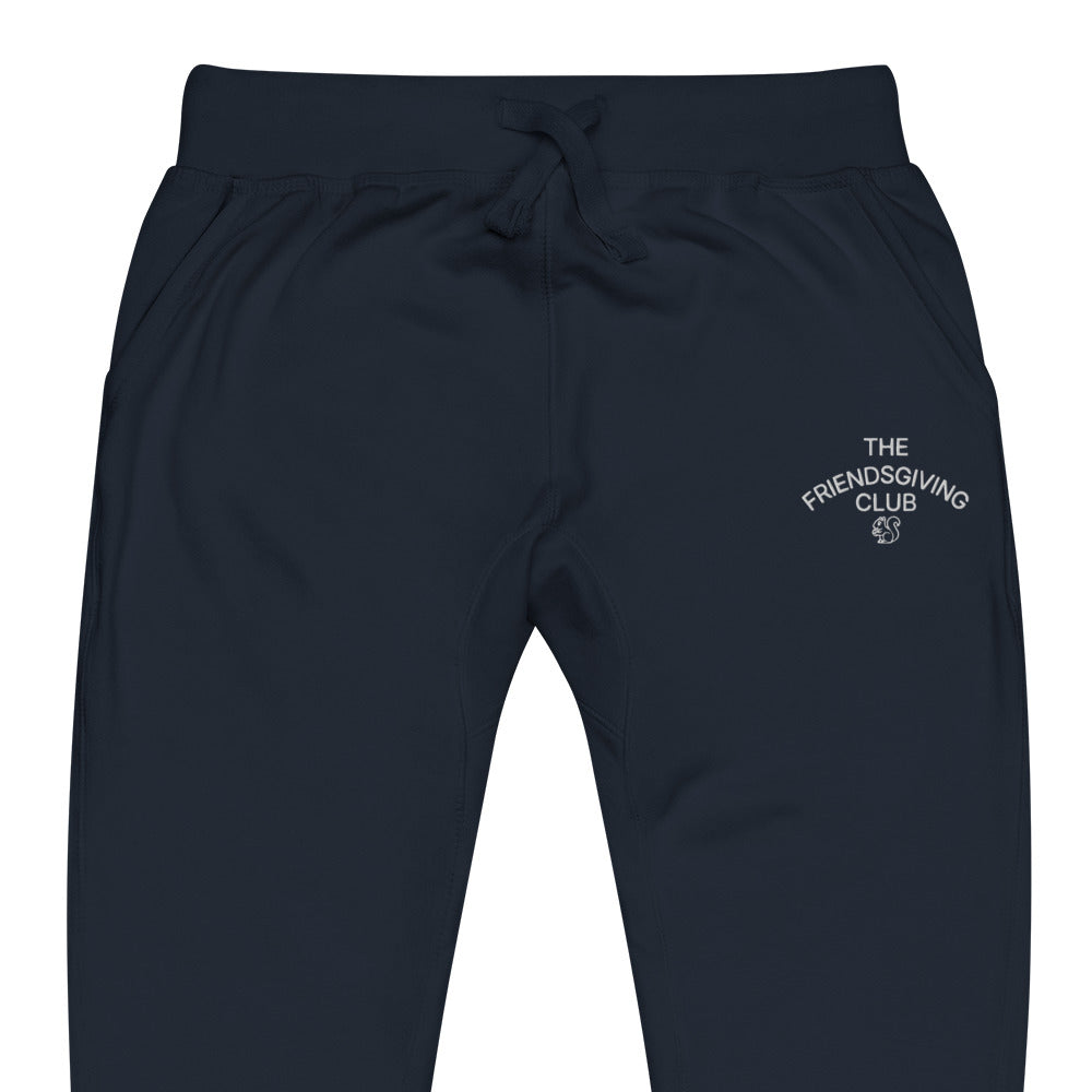 Navy pants with a white logo on a white background