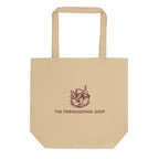 Beige tote bag with 'The Friendsgiving Shop' logo on a white background