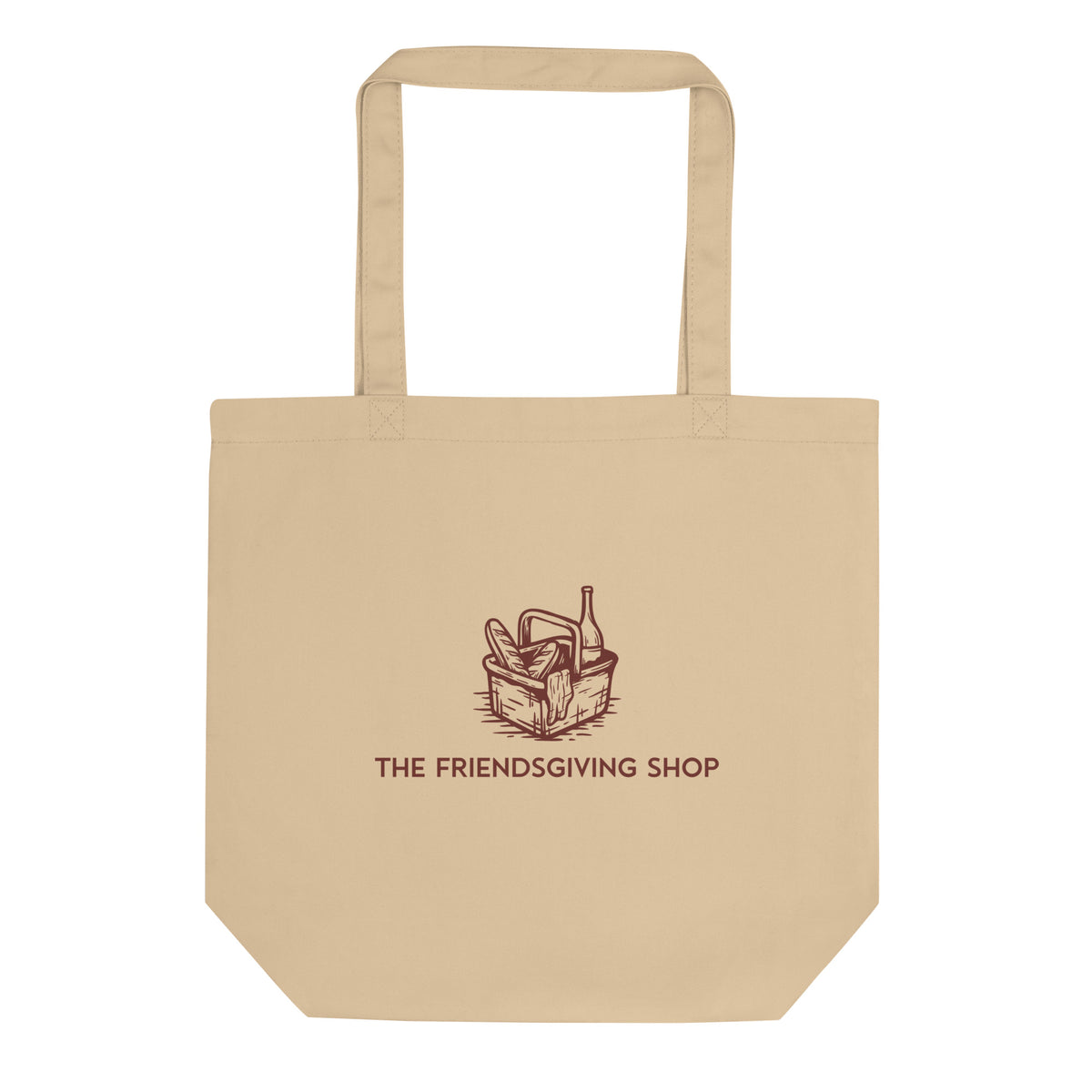 Beige tote bag with 'The Friendsgiving Shop' logo on a white background