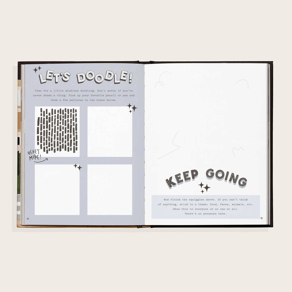 Open book with doodle prompts and text on a white background