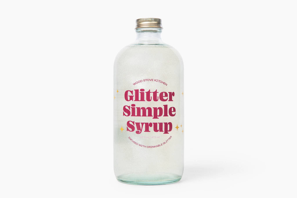 Bottle of Glitter Simple Syrup on a white background